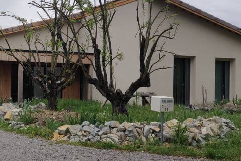 the blue tree: wood / straw frame house