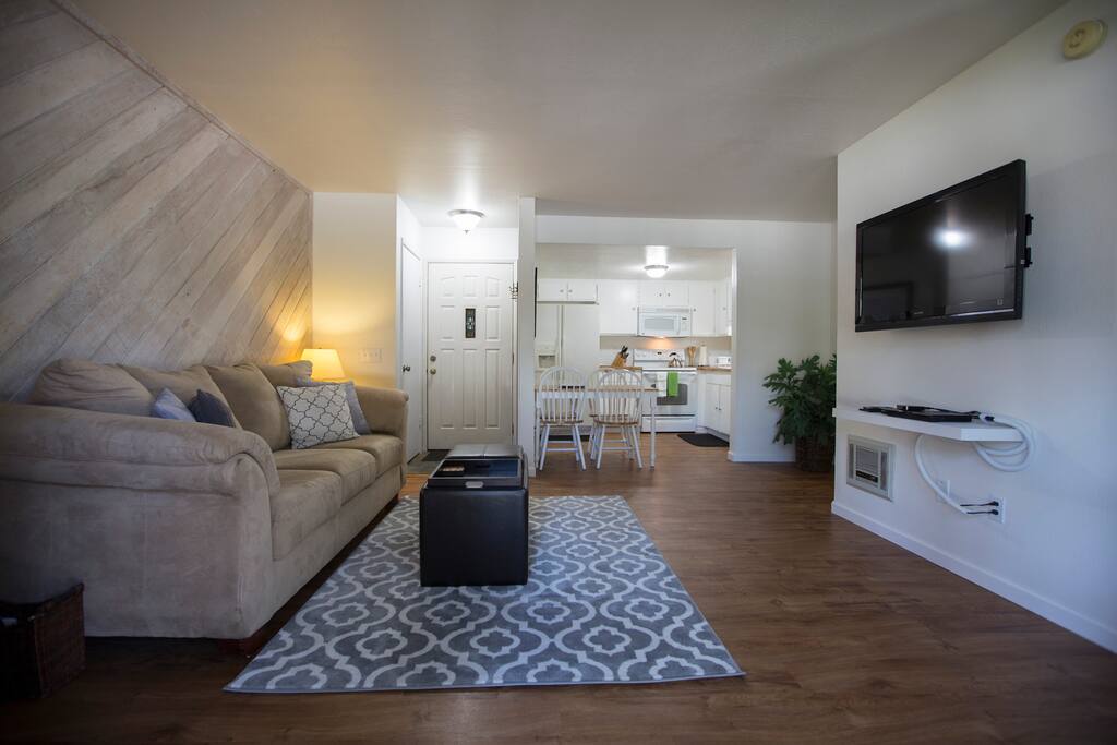 Living room, front entry and kitchen