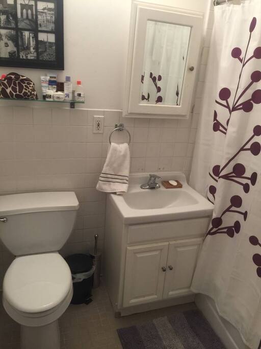 The bathroom has a full tub.