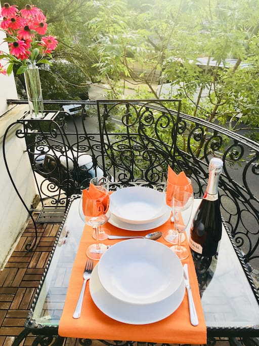 Lovely terrace with table and chairs for two, leading off from the master bedroom