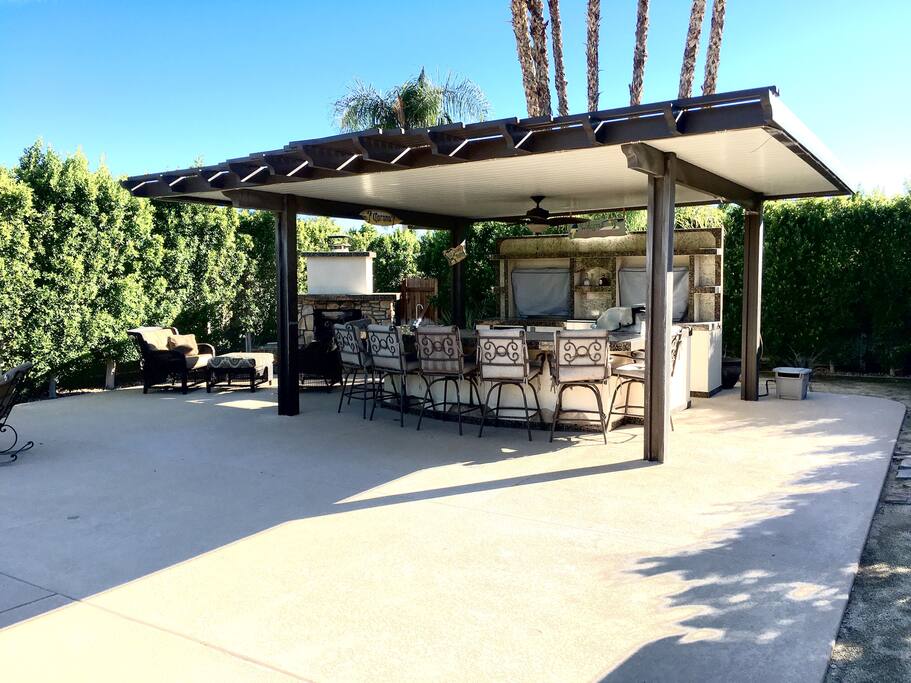 Outside BBQ/Lanai with two 40" flat screen TV's not shown along with small refrigerator and 40" Lyon BBQ