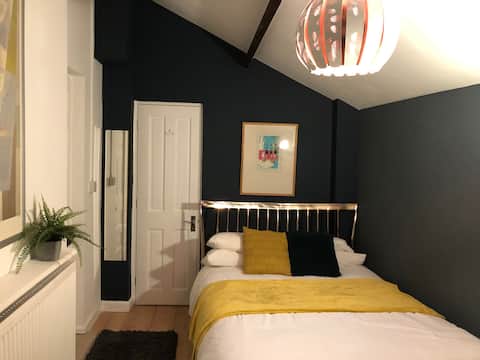 Funky private bedroom with own en suite and entry.