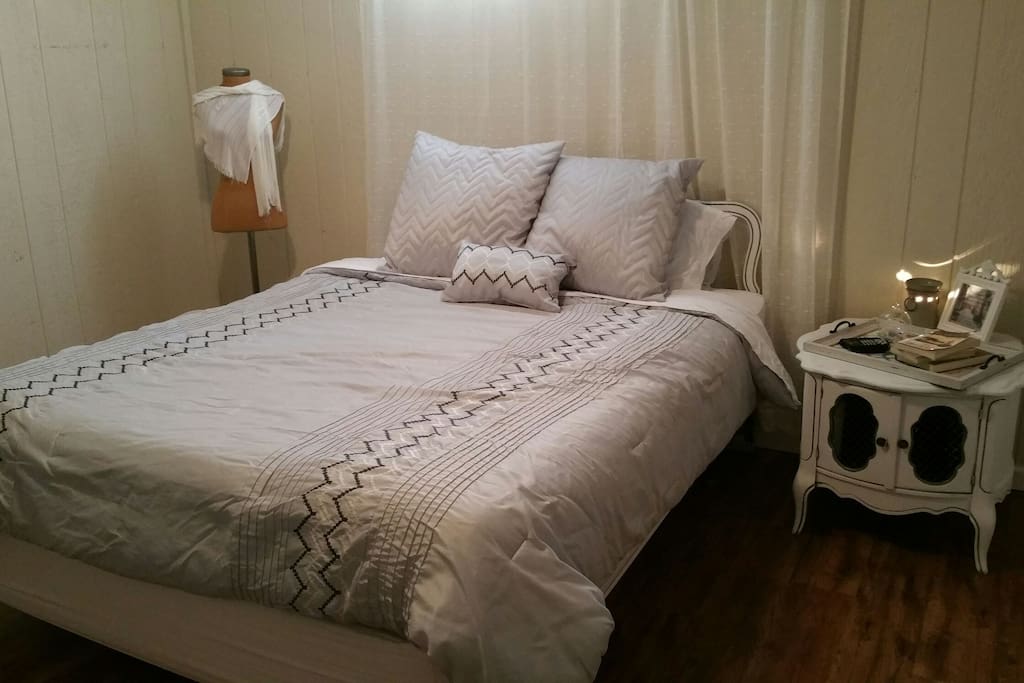 The Chic Suite. Decorated in neutral tones and reflecting a softer minimalist style, the Chic Suite is the primary bedroom. It comes with a flat screen T.V, satellite, and Netflix.