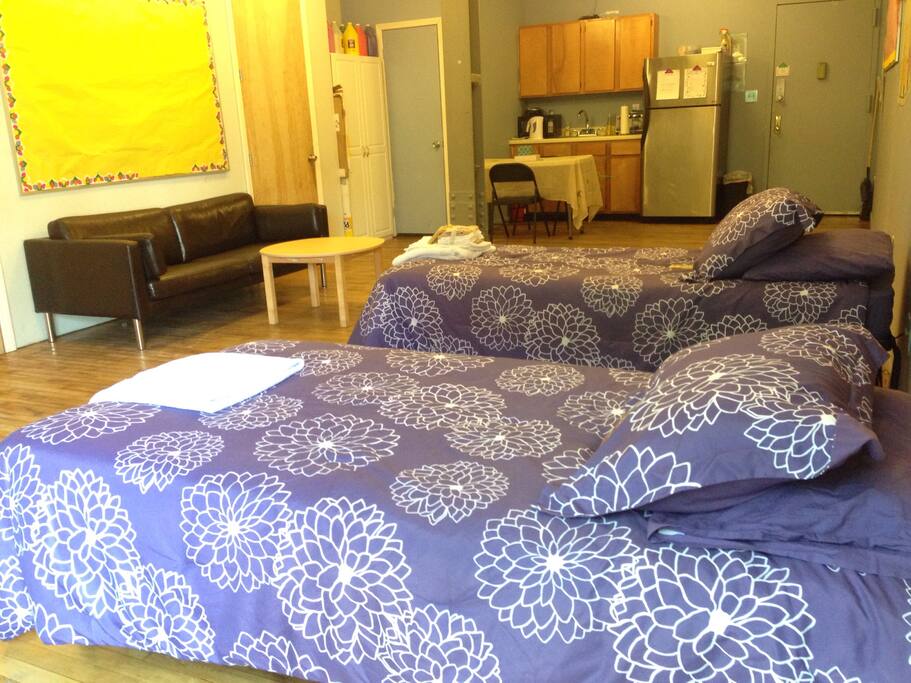 Light filled airy loft with 12 foot ceilings and 2 single beds.