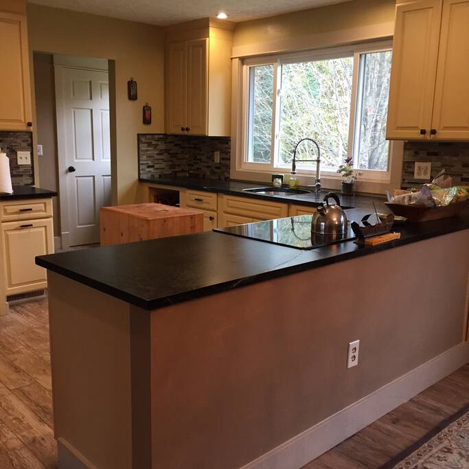 Kitchen with soapstone counters and tile floors