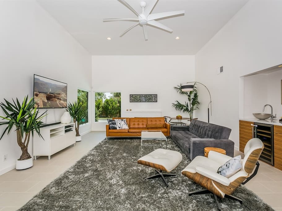 20 Foot ceilings in this spacious living room. Wine cooler included in the wet bar area.