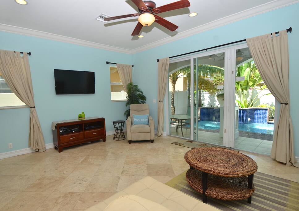 Spacious Open Living Area Overlooks Pool Lounge + Features Leather Sleeper Sofa + Chair + LED HD TV Entertainment Center...