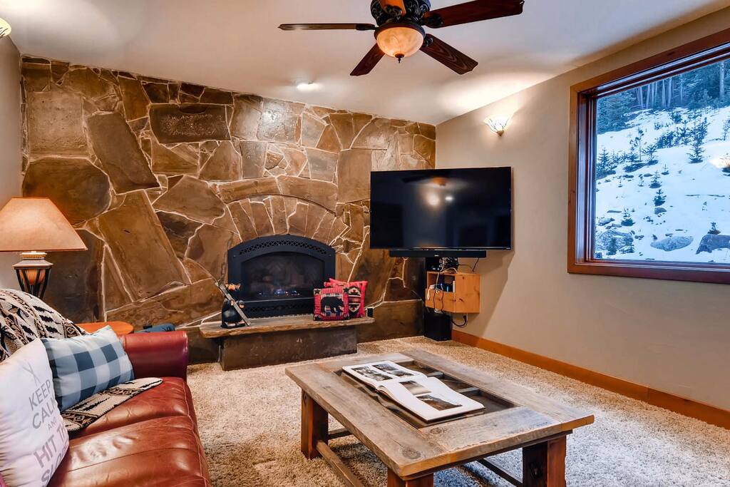Main floor living area with fireplace and nice views.