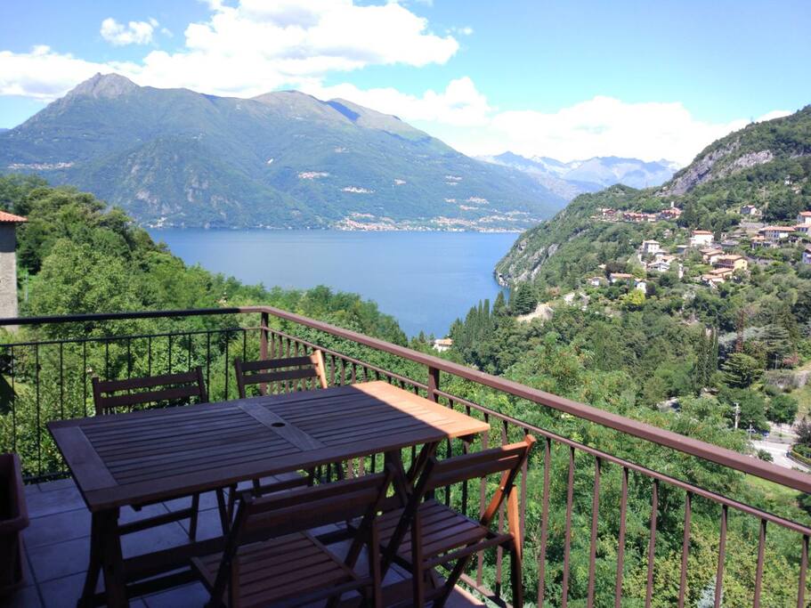 Large Balcony with a wood table for dinner and lunch with this view