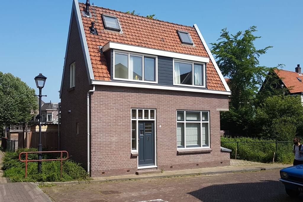 The house. The entrance is on the other side.