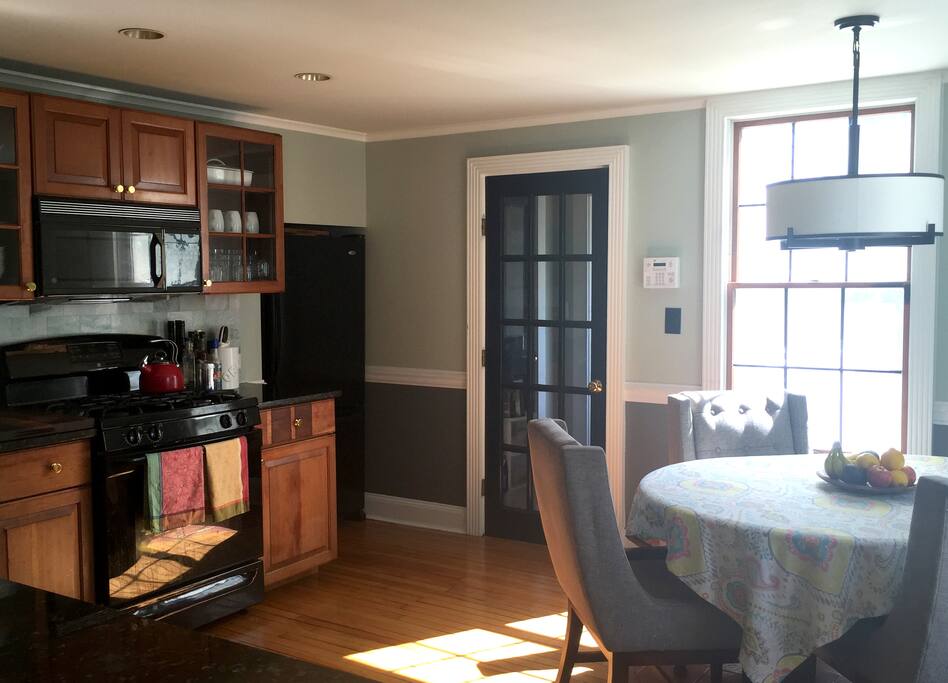 Everyone hangs out in the kitchen anyway. So why not put the dining table there?
