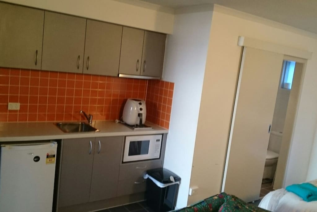 The kitchen is self contained and an airfryer and microwave to assist in quick health eating. Stove and pans are also available.
