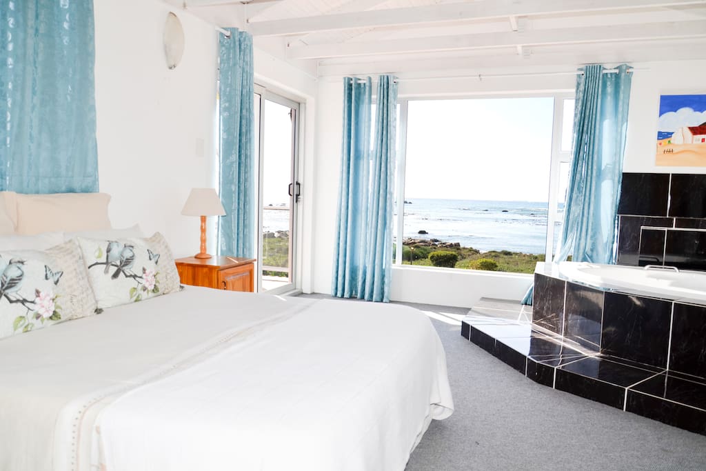 Masterbedroom with open bath area and full beach view