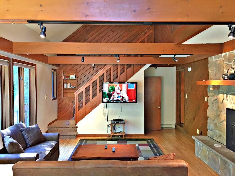 Main living area with large flat screen tv and gas fireplace
