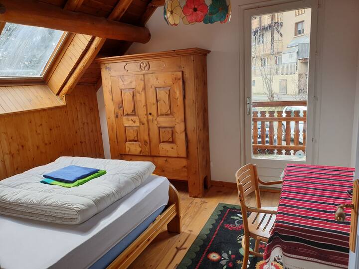 Blue room with window door on balcony and velux. Larmoire is available for your clothes.