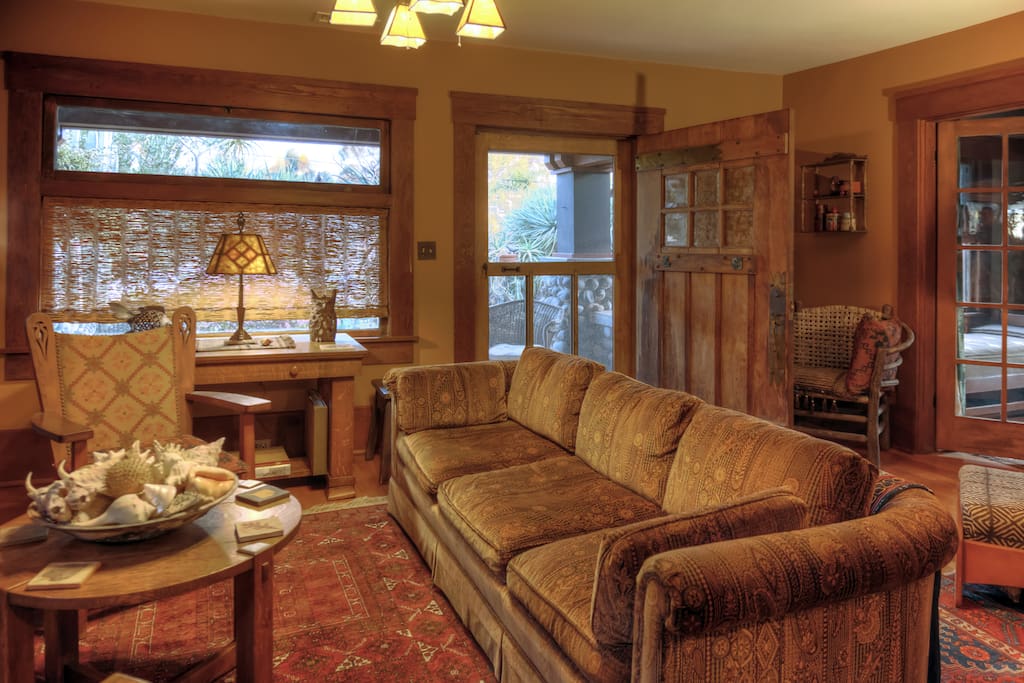 Entrance is through a four foot wide original front door into the living room and sun room.