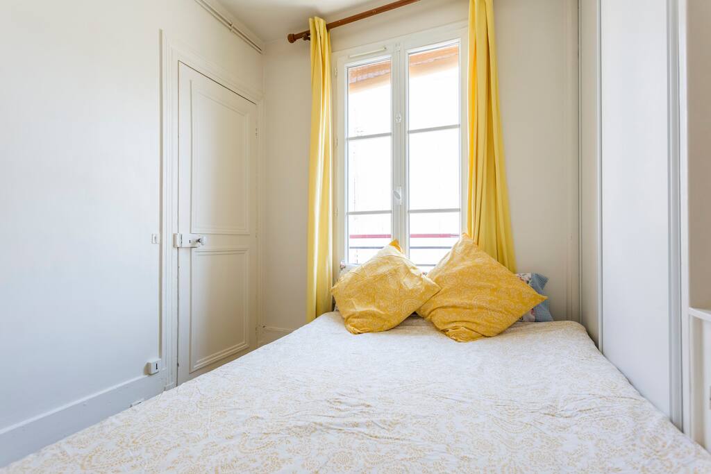 The bedroom has a bed for 2 ppl and is separated from the living room with a door