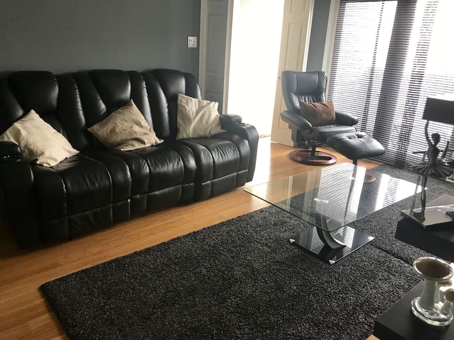 Nice and modern living room. The two chairs at the extremes recline comfortably.