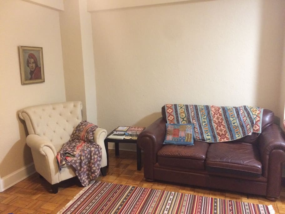 Living room seats 3: New leather couch and upholstered chair
