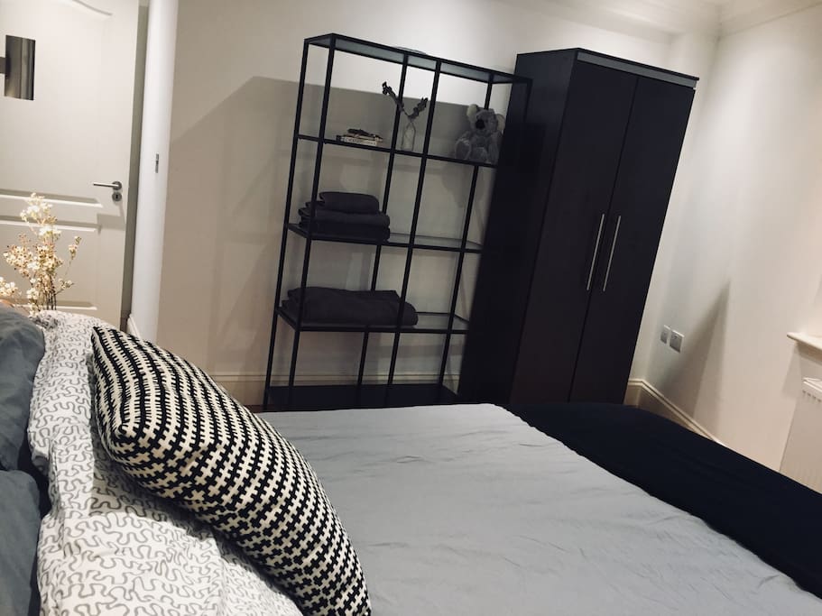Double bedroom with wardrobe and window to the garden
