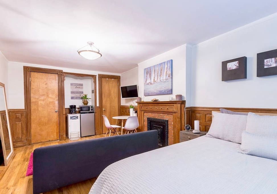 Your room has a decorative fire place and lots of sun.