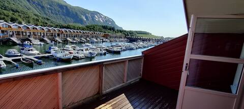 Cheerful sea house in Kløkstad harbor