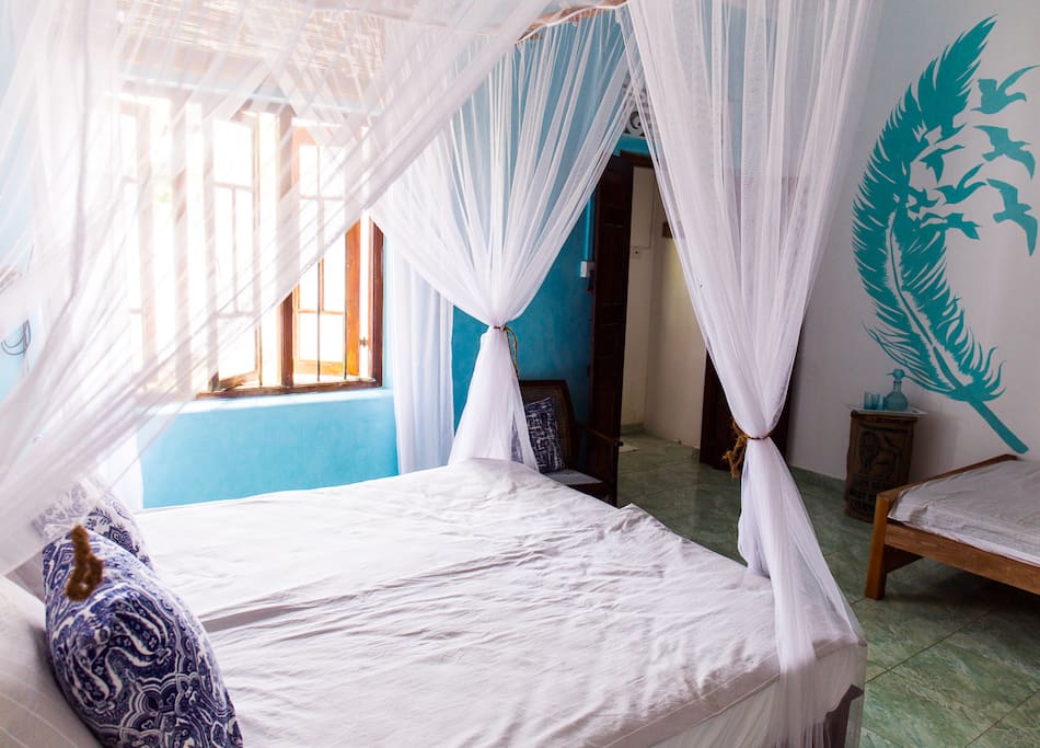 Deluxe Family Room with queen size and large single bed
