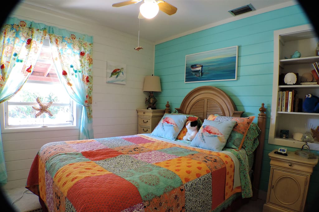Fourth Bedroom: The Sea Turtle Room has a blackout shade & new queen sized bed & box spring (Sept 2018). There’s also a ceiling fan, clock with two USB ports, an accordion door for privacy, plenty of drawers, & a clothing rack for personal items.