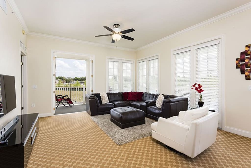 Beautiful living room complete with high speed wireless internet and overhead fan