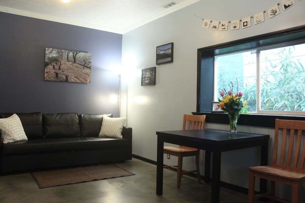 Hide-a-bed sofa that can sleep 2 and dining table can extend to accommodate 6