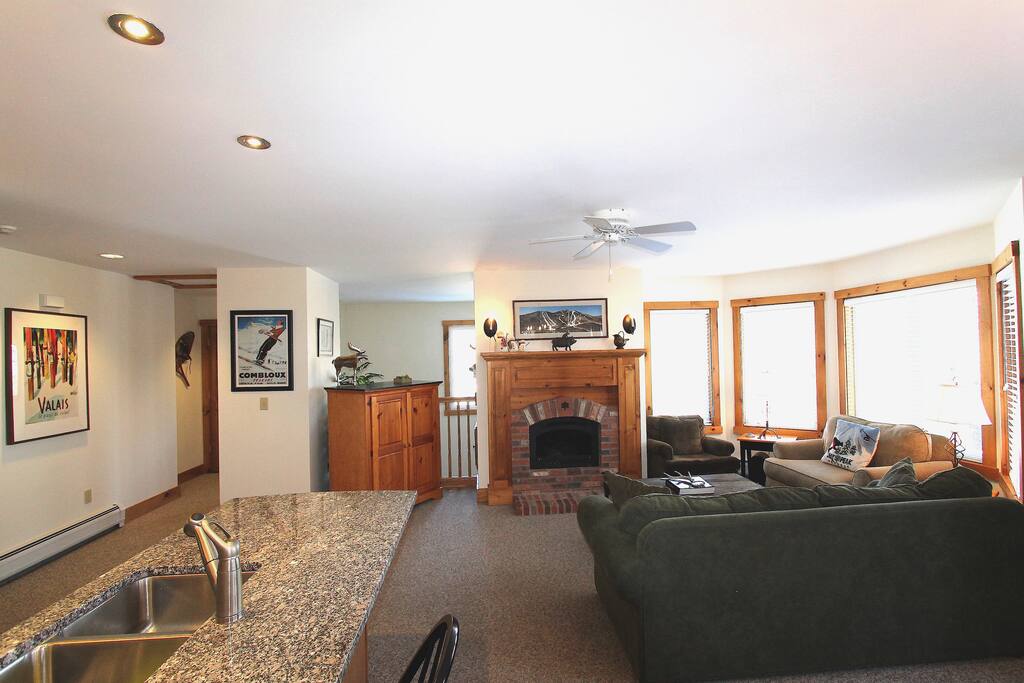 Living room area with a staircase behind