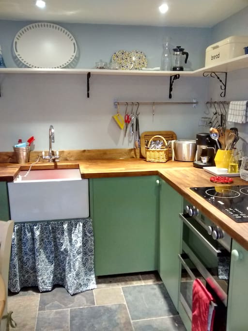 Cottage kitchen has coffee machine, double oven & hob, dishwasher, large fridge, microwave etc