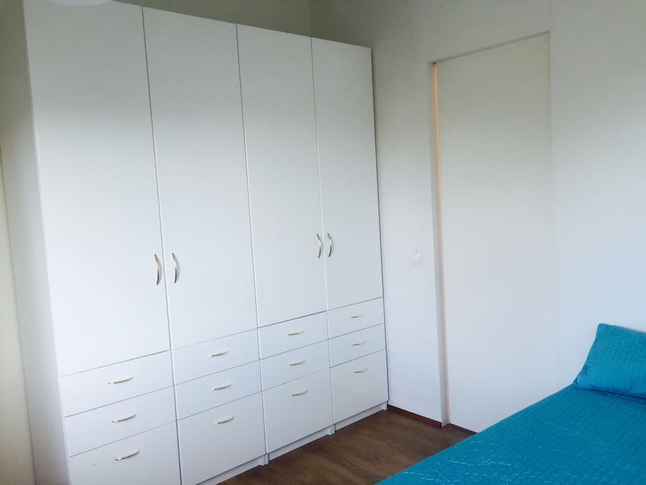 Bedroom with a closet and a bed for 2.