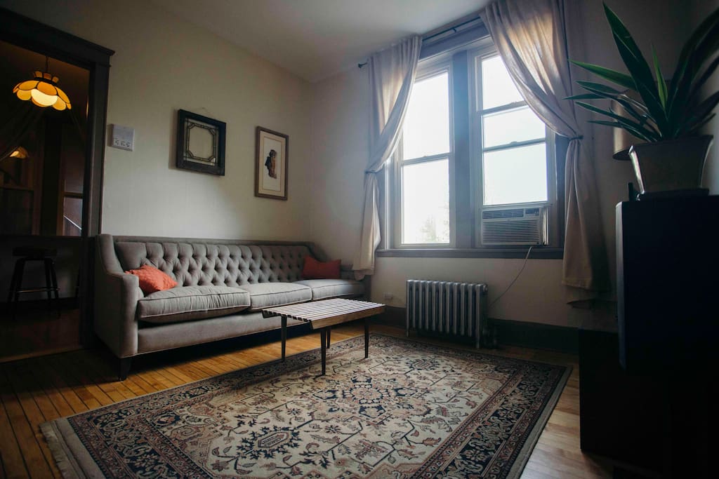 Living room view with TONS of natural southern exposure overlooking a city park!!