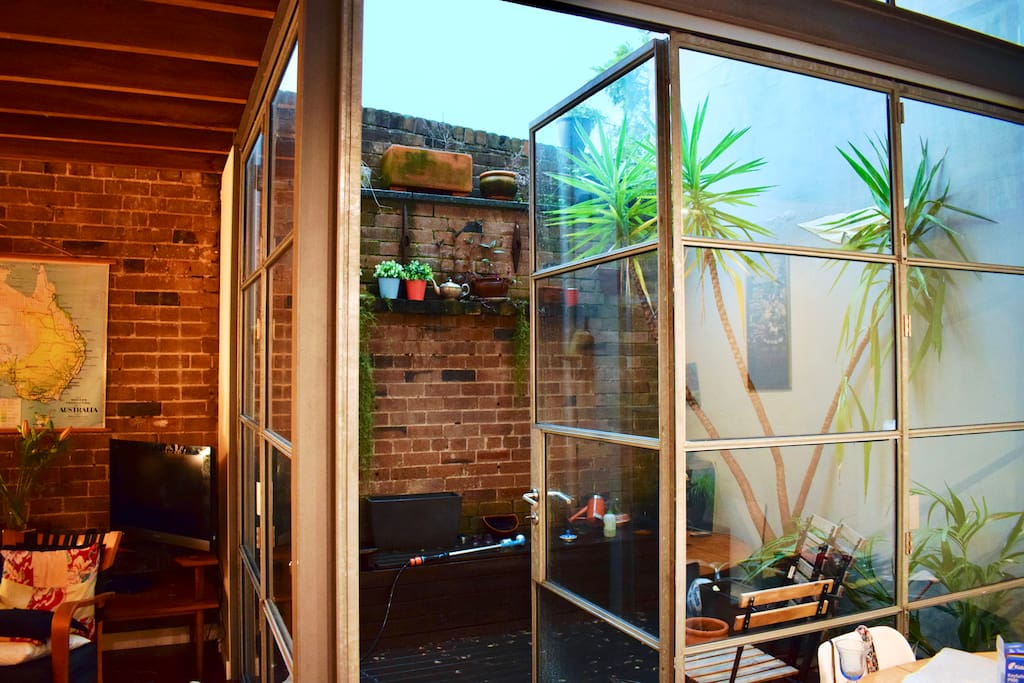 Outdoor courtyard ... extends the open plan living space, by opening both sets of bifold doors