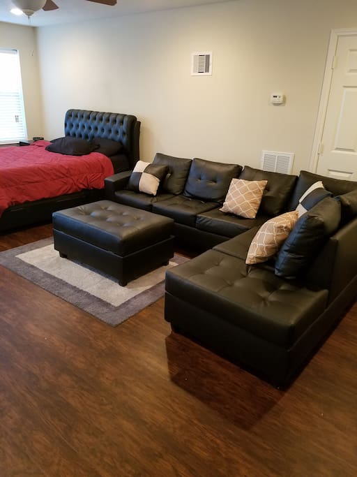 Third floor loft area with seating and sleeping arrangements