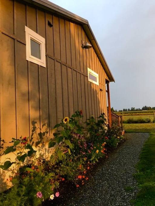 Gardens and farm fields greet you.