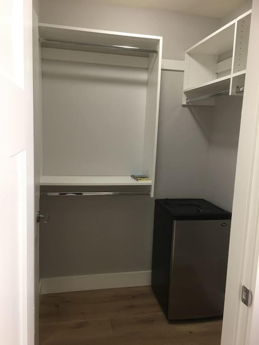 With walk-in closet and mini-fridge
