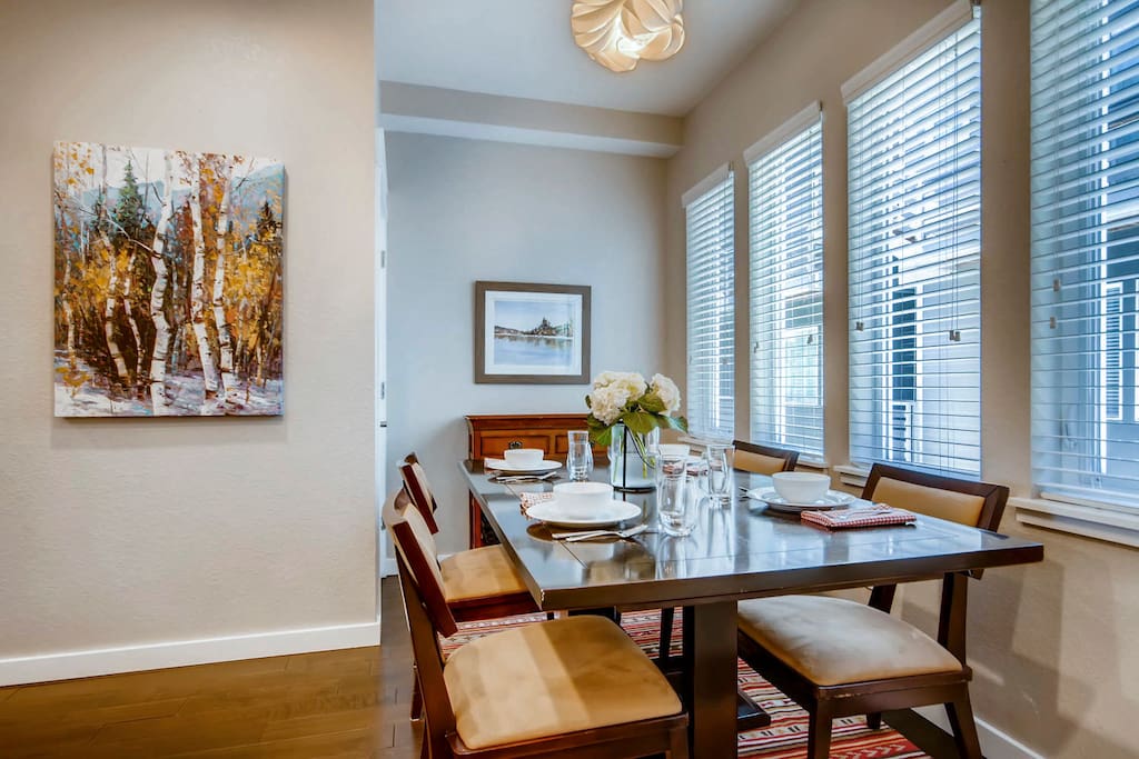 The bright dining room table provides seating for four and the countertop bar provides seating for three, making it a great place to entertain.
