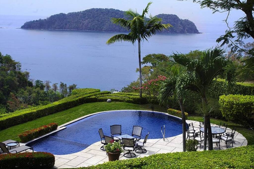 This bedroom has a great view of the pool and Herradura Bay