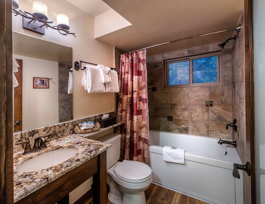 This bathroom features a BainUltra ThermoMasseur Air Jet Tub!