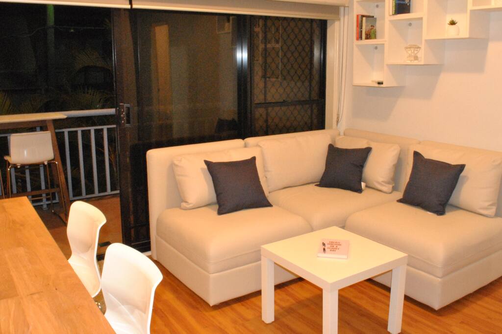 Lounge/ kitchen with comfortable new leather sofa.