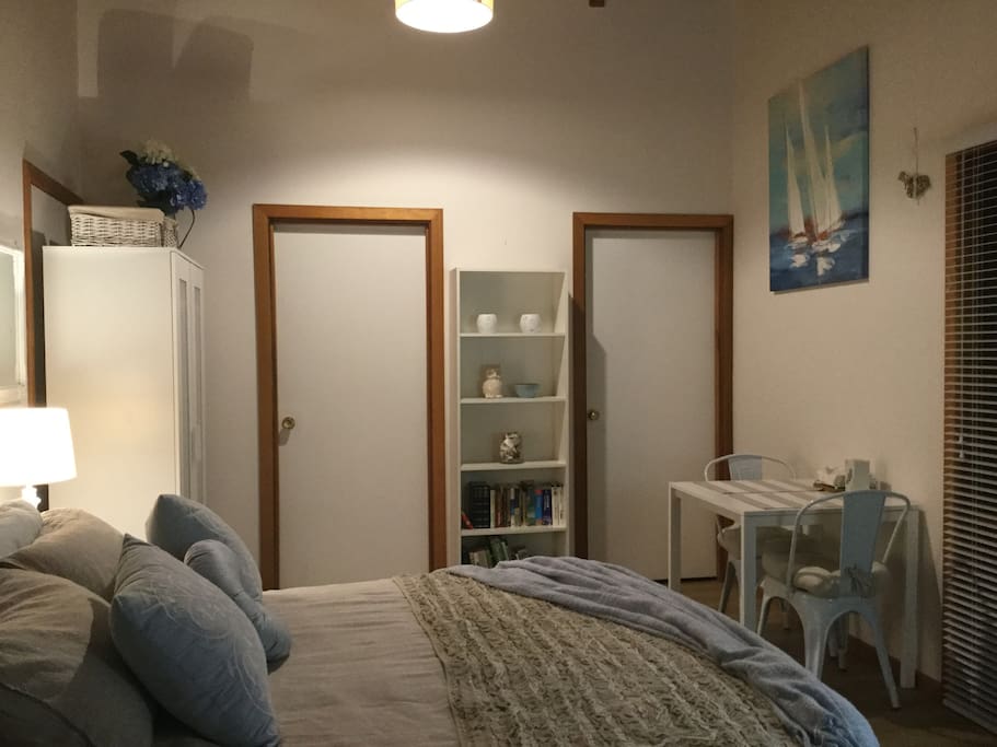 Wardrobe, iron and ironing board provided.