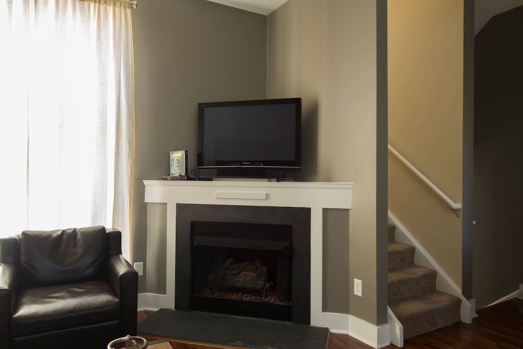 Relax and enjoy cable TV by the fireplace