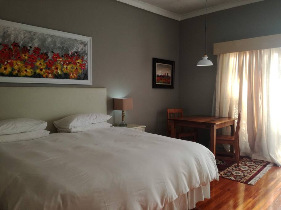 Coconut. Double room with King bed and en-suite bathroom, private entrance and patio. Full kitchenette.