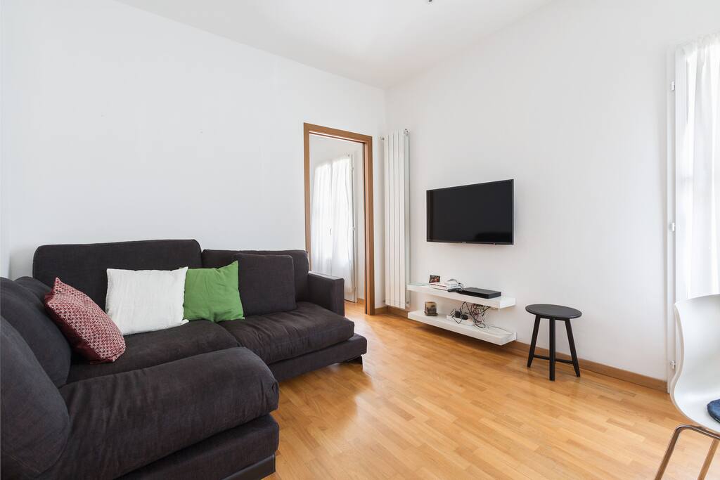 The living room: TV, equipped kitchen