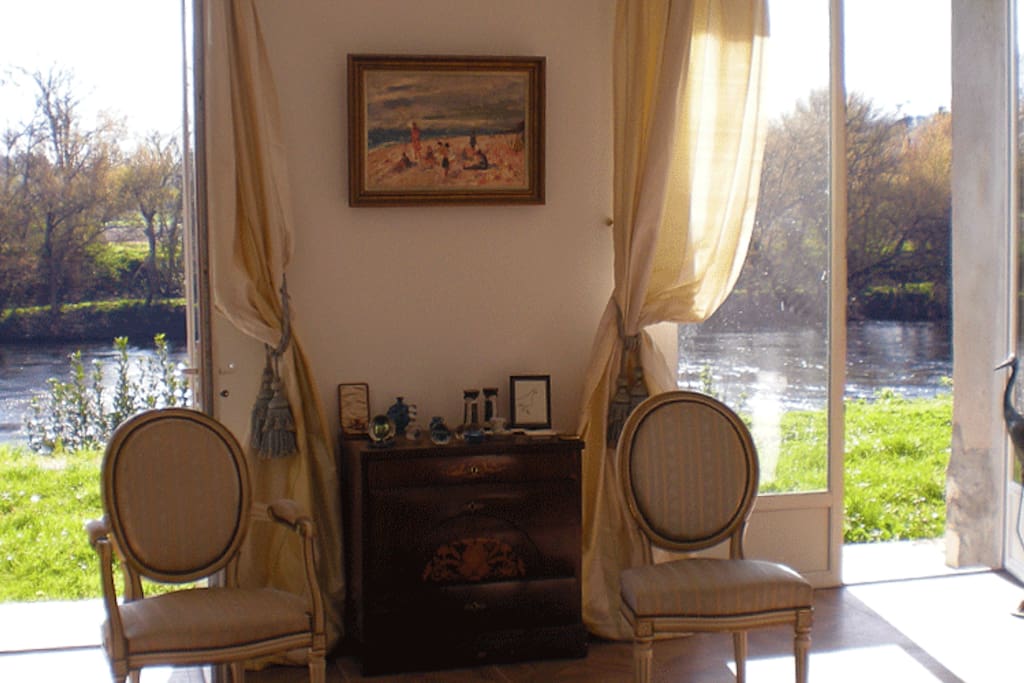 the grand salon has double doors opening out onto the terrace