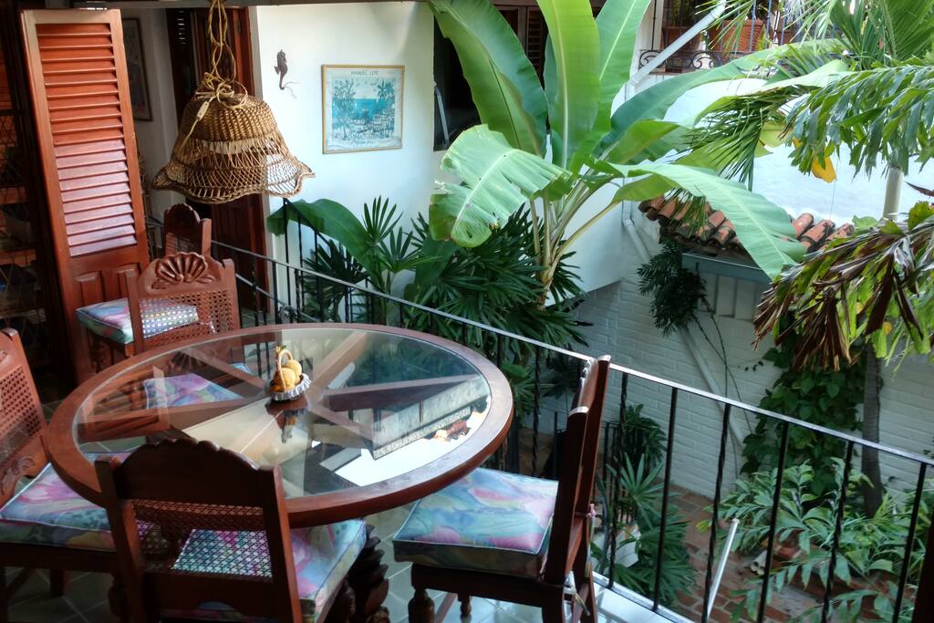Dining & living room overlooks the 3 story open air courtyard