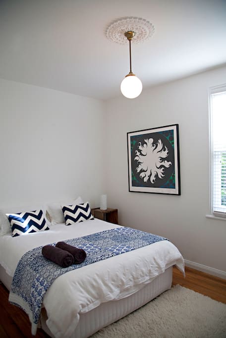 Light and airy queen bedroom