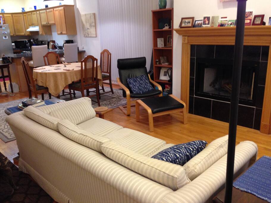Open living room/dining room/kitchen on main floor of our two story apartment.